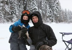 Steven and his son Cole enjoying a day of ice fishing.