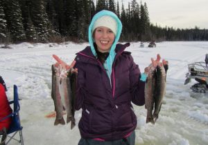 Carli with a nice catch of Rainbow Trout. Her first time ice fishing!