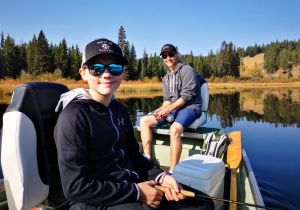 Father & Son Enjoying a Day Fly Fishing a Small Mountain Lake
