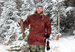 Ron of Cairns Australia with his first Rainbow caught ice fishing.