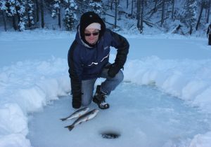Michael of Perth Australia with some fine ice caught Rainbows.